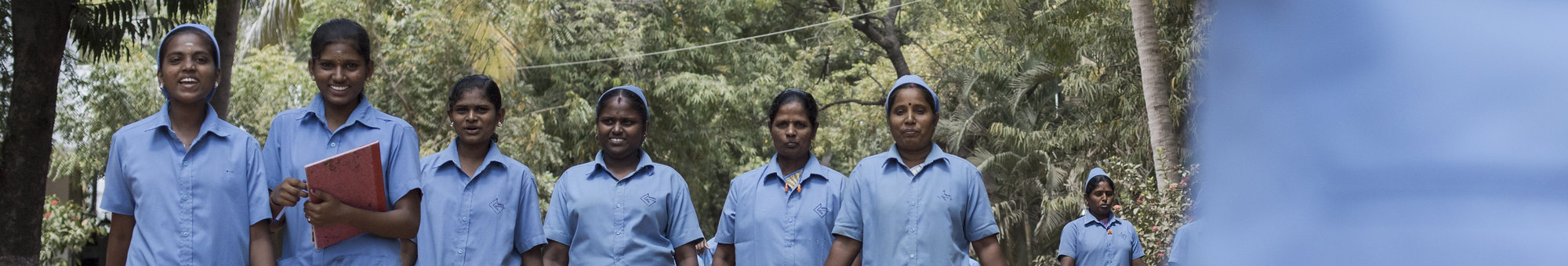 Smiling female garment workers, India