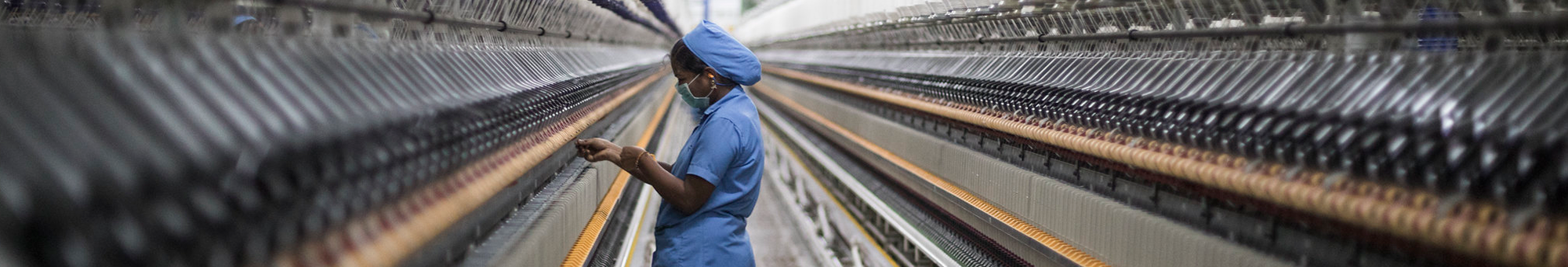 Female garment worker in factory India