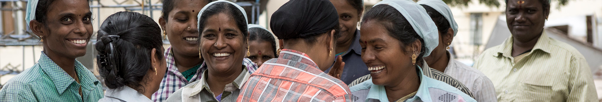 Group of female garment workers in India, laughing