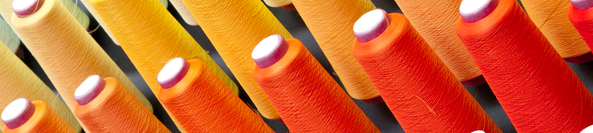 Orange cotton thread spools