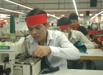Cambodian male garment workers © ILO