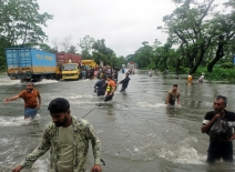 Feni,Bangladesh 24.08.2024 : In heavy rains, the neighboring areas are submerged in floods. The main highway of Bangladesh was submerged in flood water. Photo credit: Shutterstock.